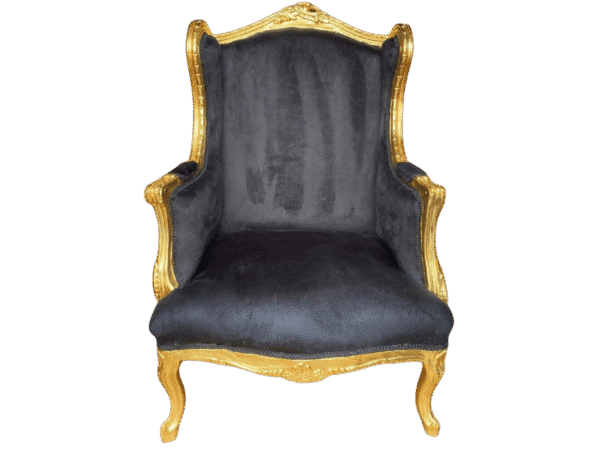 Face profile of a Baroque wing chair with gold carvings and black fabric.